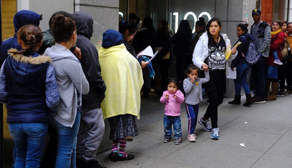 Judge blocks Trump rule restricting immigrants reliant on public assistance