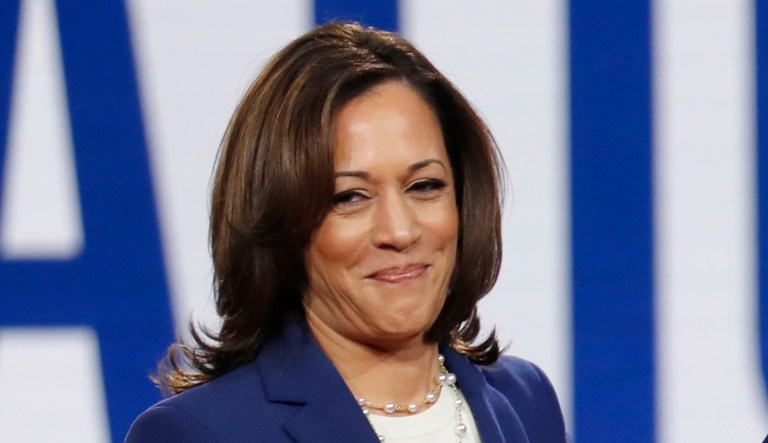 Democratic presidential candidate Sen. Kamala Harris, D-Calif., left, Sen. Bernie Sanders, I-Vt., and former Vice President Joe Biden, right, stand on stage before a Democratic presidential primary debate hosted by CNN/New York Times at Otterbein University, Tuesday, Oct. 15, 2019, in Westerville, Ohio. 