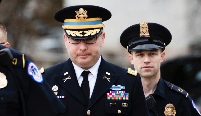 Army Lieutenant Colonel Alexander Vindman, a military officer at the National Security Council, center, arrives on Capitol Hill in Washington, Tuesday, Oct. 29, 2019.