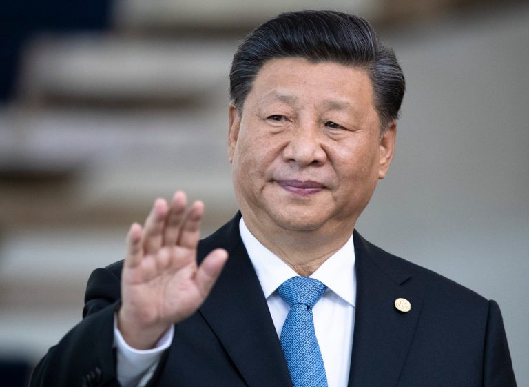 China's President Xi Jinping greets the media prior to a meeting of leaders of the BRICS emerging economies at the Itamaraty palace in Brasilia, Brazil, Thursday, Nov. 14, 2019.