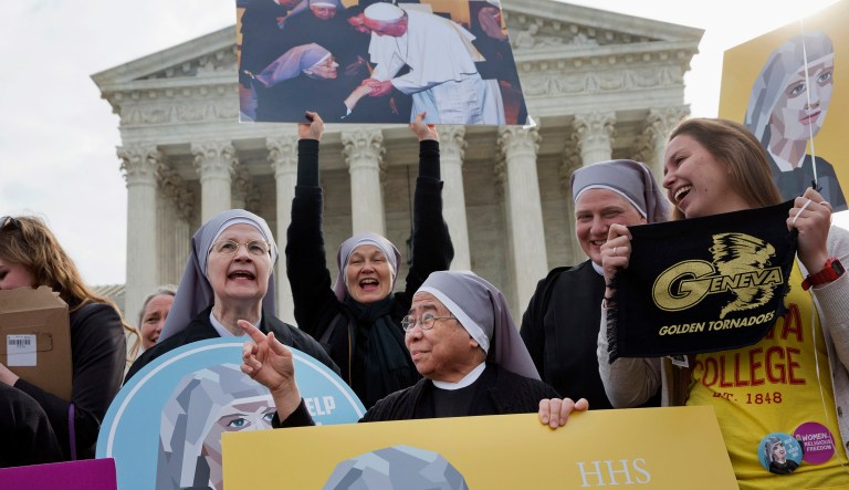 Nuns with the Little Sisters of The Poor, including Sister Celestine, left, and Sister Jeanne Veronique, center, rally outside the Supreme Court in Washington, Wednesday, March 23, 2016, as the court hears arguments to allow birth control in healthcare plans in the Zubik vs. Burwell case. 
