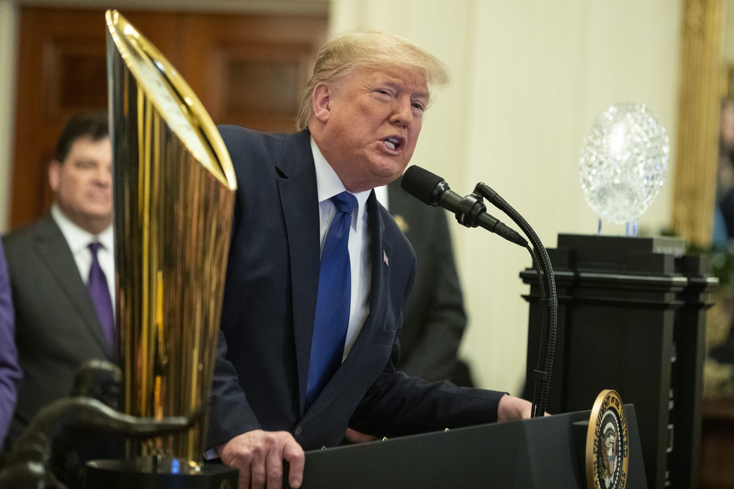 Trump stokes backlash after poking fun at himself during visit with LSU football team