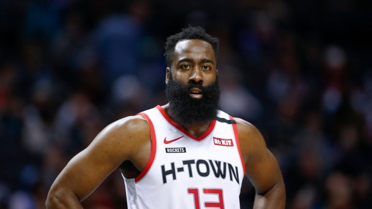 Houston Rockets guard James Harden stands on the court during a break in the action against the Charlotte Hornets during the second half of an NBA basketball game in Charlotte, N.C., Saturday, March 7, 2020. Charlotte won 108-99.