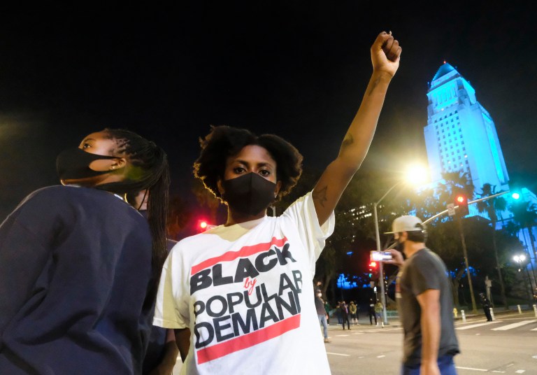Demonstrators protest during a protest of the death of George Floyd, a black man who was in police custody in Minneapolis, in downtown Los Angeles, Wednesday, May 27, 2020. 