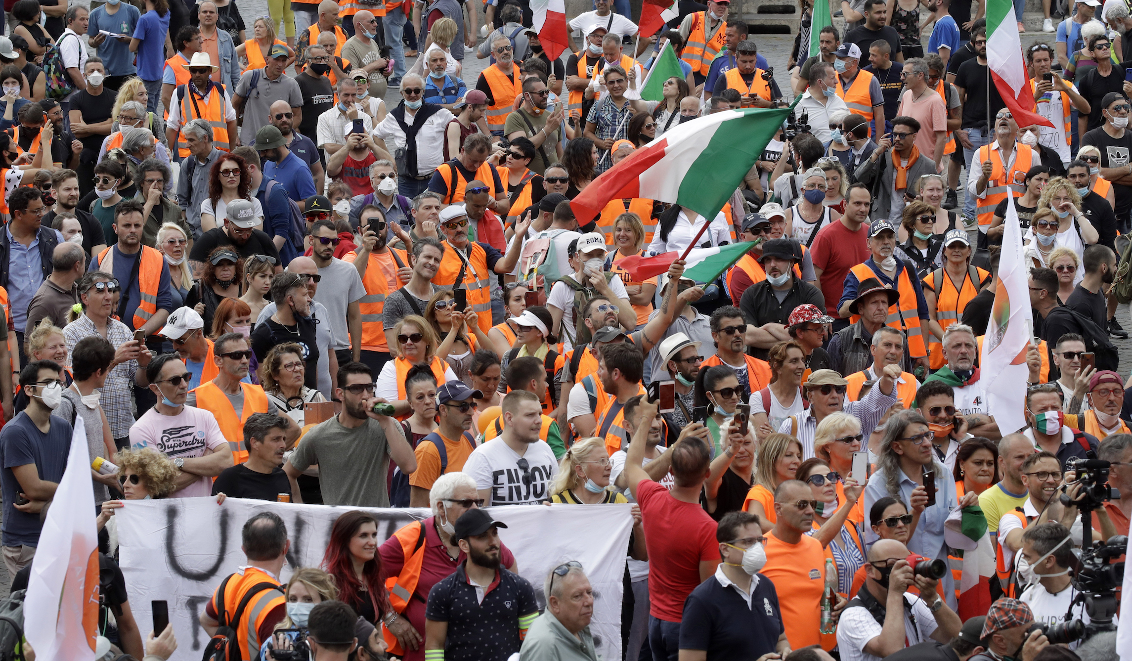‘Breathing is sacred’: Orange vest protesters reject masks during reopening protests in Italy
