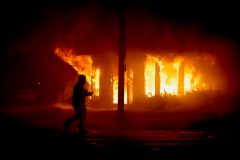 ‘Trying to stop them from hurting their own community’: Armed citizens protect businesses during Kenosha riots