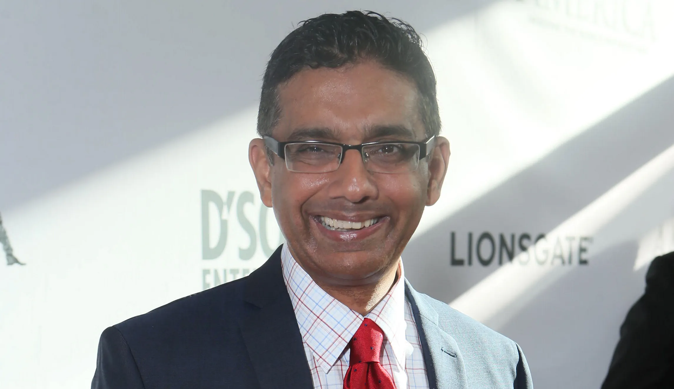 Trump to pardon conservative author Dinesh D’Souza