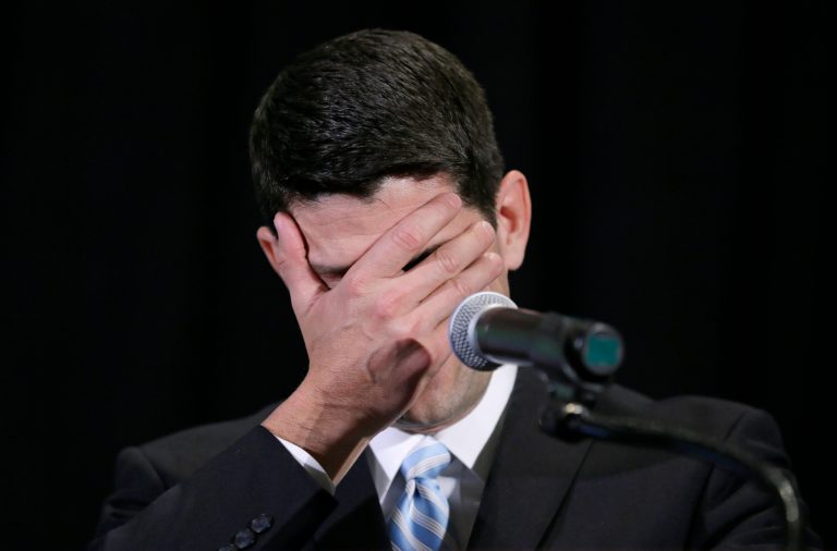 U.S. Rep. Paul Ryan, R-Wis., reacts as he tells a joke while speaking at the Iowa Republican Party's annual Lincoln Day dinner, Friday, April 11, 2014, in Cedar Rapids, Iowa. He announced this week that he won't seek reelection.