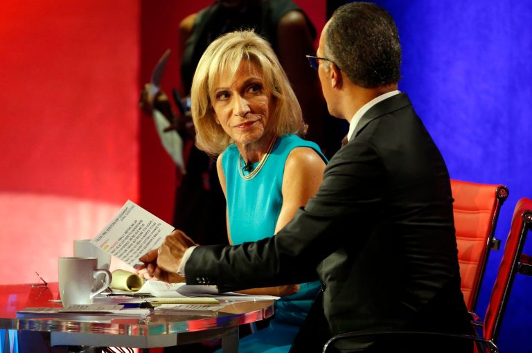 NBC moderators Lester Holt and Andrea Mitchell speak during a break at the NBC, YouTube Democratic presidential debate at the Gaillard Center, Sunday, Jan. 17, 2016, in Charleston, S.C.