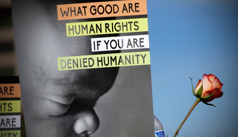 An anti-abortion supporter holds a poster.
