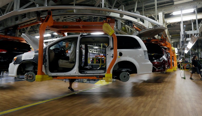 A 2016 Dodge Grand Caravan moves on the assembly line at the Windsor Assembly Plant, Friday, May 6, 2016 in Windsor, Ontario, Canada.