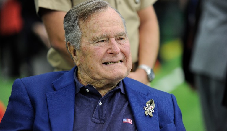 Former President George H.W. Bush arrives at NRG Stadium to help celebrate Salute to Service day before an NFL football game between the Houston Texans and the Detroit Lions, Sunday, Oct. 30, 2016, in Houston.
