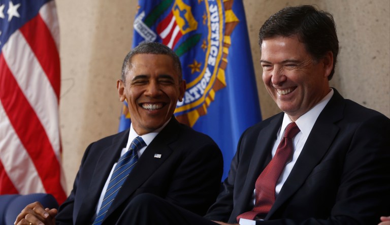 President Barack Obama and FBI Director James Comey laugh at an installation ceremony at FBI Headquarters. 