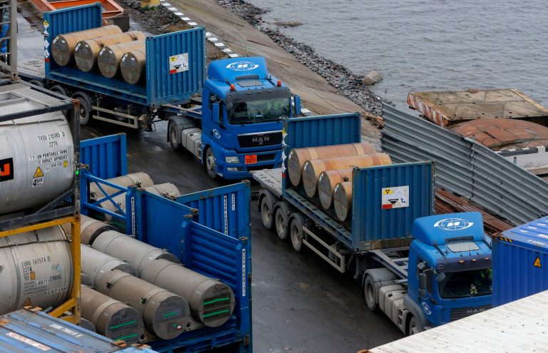 Trucks carrying containers with uranium to be used as fuel for nuclear reactors line up for loading them on a port in St. Petersburg, Russia.