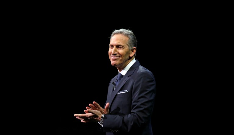 Starbucks CEO Howard Schultz pauses as he speaks to applaud employees at the Starbucks annual shareholders meeting Wednesday, March 22, 2017, in Seattle. 