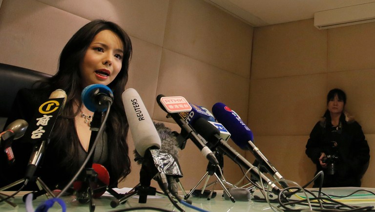 Canada's Miss World contestant Anastasia Lin speaks to media after she was denied entry to mainland China, at Hong Kong International Airport in Hong Kong, Friday, Nov. 27, 2015. Canada's outspoken Miss World contestant said she was barred Thursday from entering China to take part in this year's pageant and accused Beijing of overreach in extending its campaign of censorship even to beauty contests. (AP Photo/Vincent Yu)