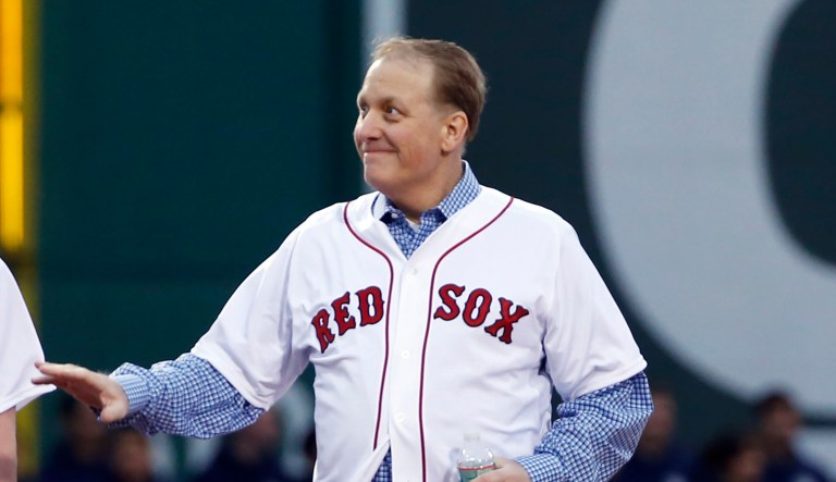 Former Boston Red Sox pitcher Curt Schilling walks onto the infield at Fenway Park prior to a baseball game against the Atlanta Braves in Boston, Wednesday, May 28, 2014. The Red Sox honored the 2004 World Series team prior to the game.