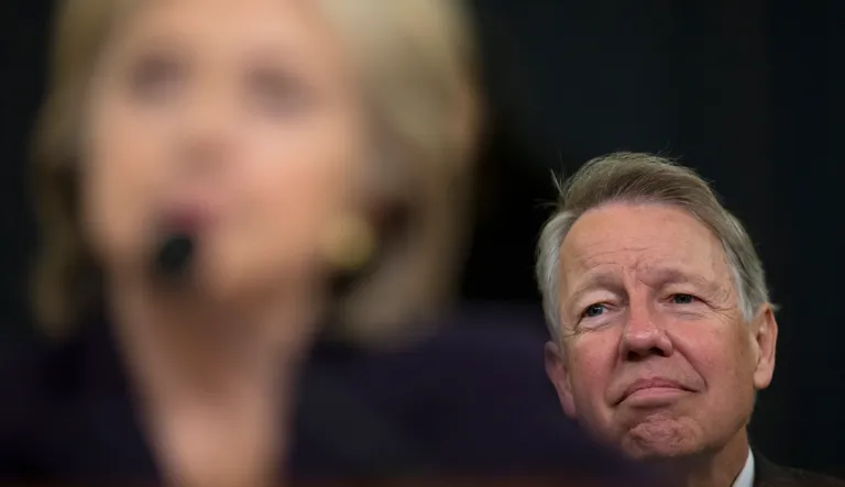 David Kendall, personal attorney for Democratic presidential candidate, former Secretary of State Hillary Rodham Clinton, listens at right and she testifies on Capitol Hill in Washington, Thursday, Oct. 22, 2015.