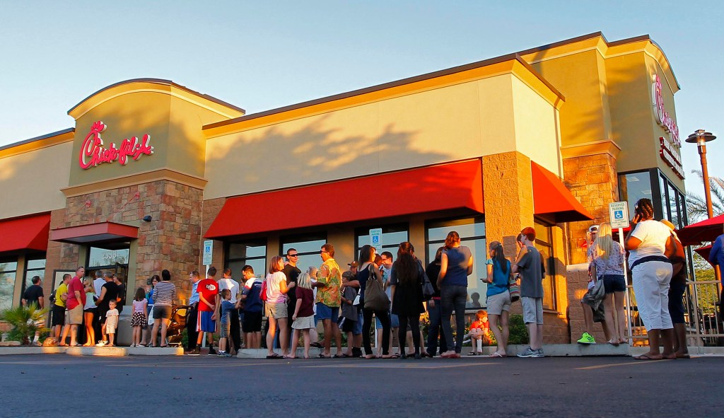 Chick-fil-A worker jumps through drive-thru window to save child