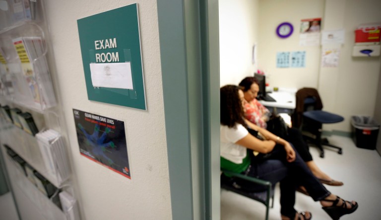 Two women wait in an exam room at Nuestra Clinica Del Valle, in San Juan, Texas. 