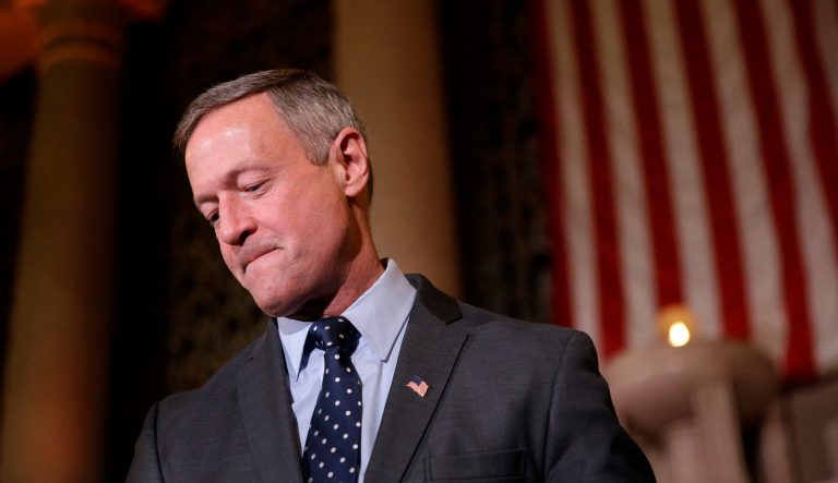 Former Maryland Gov. Martin O'Malley stands onstage following an inauguration ceremony for Baltimore Mayor Catherine Pugh inside the War Memorial Building in Baltimore, Tuesday, Dec. 6, 2016. 