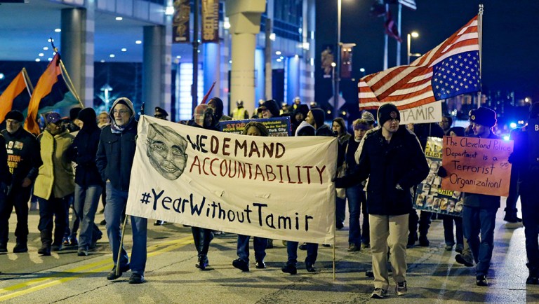 People protest a grand jury's decision not to indict two white Cleveland police officers in the fatal shooting of Tamir Rice, a black 12-year-old boy who was playing with a pellet gun.