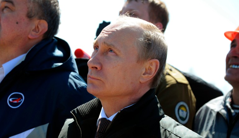 Russian President Vladimir Putin watches the launch of a Russian rocket carrying satellites at the new Vostochny Cosmodrome outside the city of Uglegorsk on April 28, 2016.