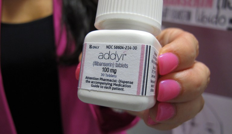 FILE - In this Aug. 18, 2015 file photo, Sprout Pharmaceuticals CEO Cindy Whitehead holds a bottle for the female sex-drive drug Addyi at her Raleigh, N.C. Most women with low sexual desire wonât rush out to get the first prescription drug to boost female libido when it launches on Saturday, Oct. 17, 2015. But they may have more options down the road.