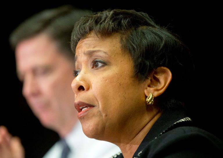 Attorney General Loretta Lynch, right, and FBI Director James Comey participate in a sit down meeting with members of the media at Justice Department in Washington, Thursday, Nov. 19, 2015, to discuss the U.S. government's ongoing counterterrorism efforts.