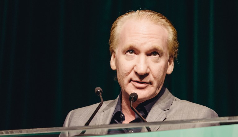 Bill Maher speaks at an event.
