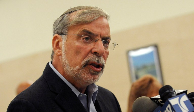 New York politician Dov Hikind speaks to the media at a press conference.