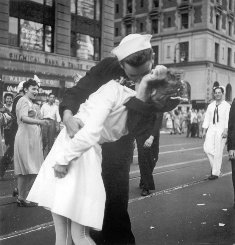 FILE - In this Aug. 14, 1945 file photo provided by the U.S. Navy, a sailor and a nurse kiss passionately in Manhattan's Times Square, as New York City celebrates the end of World War II. 