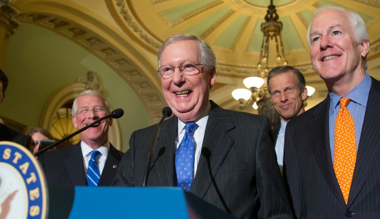 Senate Majority Leader Mitch McConnell, R-Ky.,smiles and speaks to reporters as he is joined by Majority Whip John Cornyn, R-Texas, Sen. John Thune, R-S.D., and Sen. Roger Wicker, R-Miss., following a closed-door meeting on Capitol Hill. 