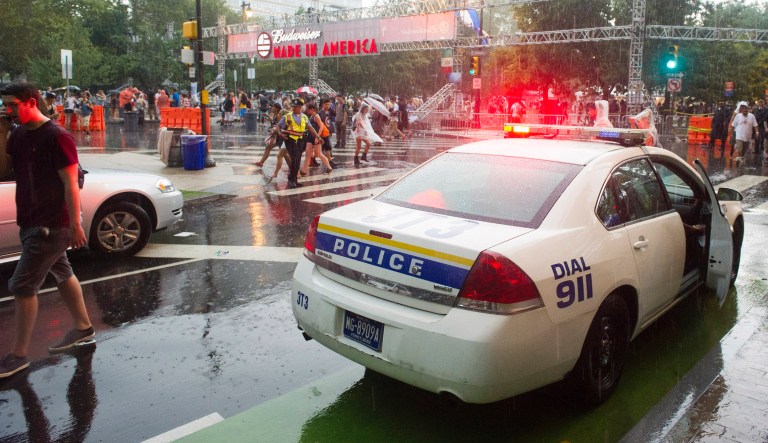 Police help clear out the Made in America Festival after the grounds are evacuated due to thunderstorms on Sunday, Aug. 31, 2014, in Philadelphia. 