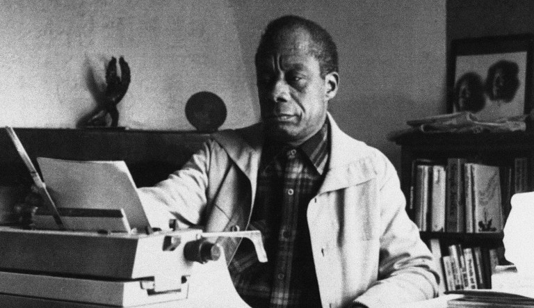 This photo, dated March 15, 1983, shows American writer James Baldwin posing in front of his typewriter in his house in Saint Paul de Vence, France.