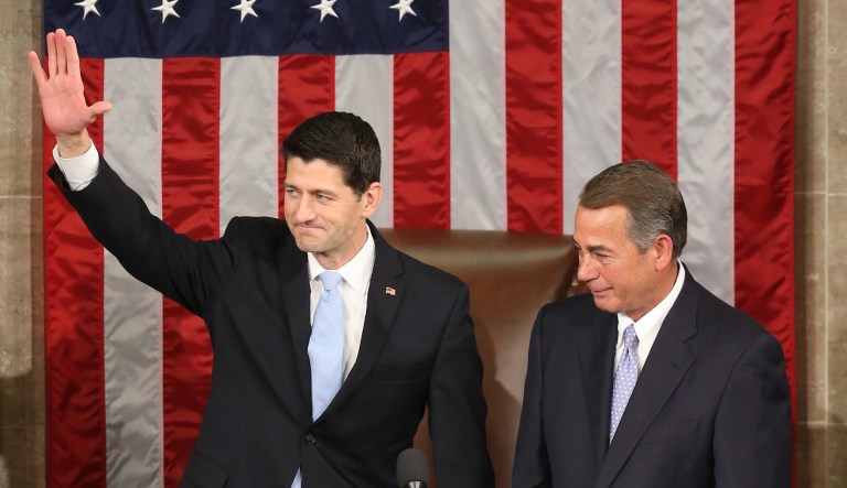 Rep. Paul Ryan, R-Wis., accompanied by outgoing House Speaker John Boehner, waves in the House Chamber on Capitol Hill in D.C. on Oct. 29, 2015.