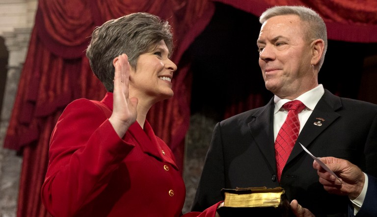 Vice President Joe Biden administers the Senate oath to Sen. Joni Ernst R-Iowa, with her husband Gail Ernst and daughter Libby, during a ceremonial re-enactment swearing-in ceremony, Tuesday, Jan. 6, 2015, in the Old Senate Chamber of Capitol Hill in Washington.