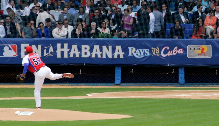 Tampa Bay Rays batman bats the ball as Presidents Obama and Castro watch during a baseball match between the Tampa Bay Rays and Cuba in Havana, Cuba, Tuesday March 22, 2016. 
