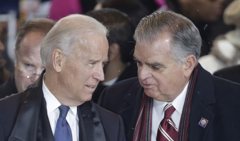 Vice President Joe Biden and Transportation Secretary Ray LaHood, right, talk as they watch Obama's second inaugural parade. (AP Photo/Gerald Herbert)
