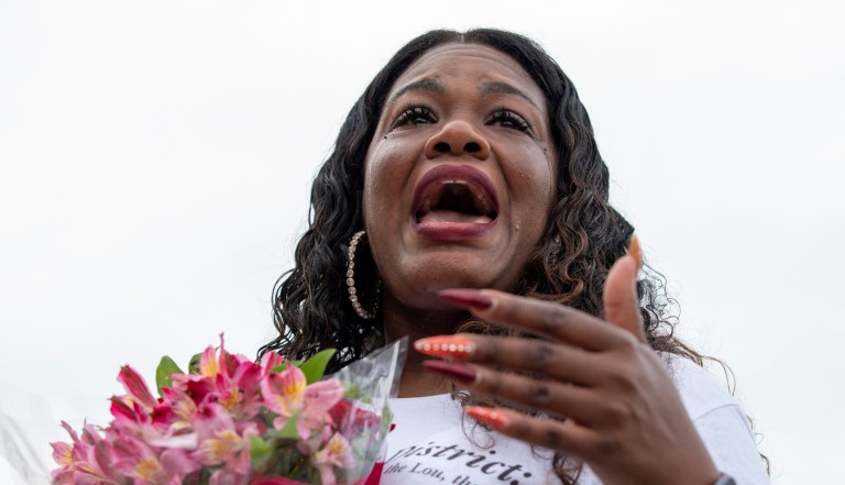 Rep. Cori Bush cries after it was announced that the Biden administration will enact a targeted nationwide eviction moratorium outside of Capitol Hill in Washington on Tuesday, August 3, 2021. 