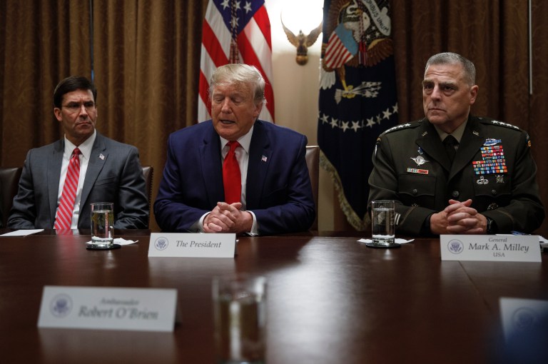 President Trump, joined by from left, Defense Secretary Mark Esper, and Chairman of the Joint Chiefs of Staff Gen. Mark Milley, speaks to media during a briefing with senior military leaders in the Cabinet Room at the White House in Washington, Monday, Oct. 7, 2019. 