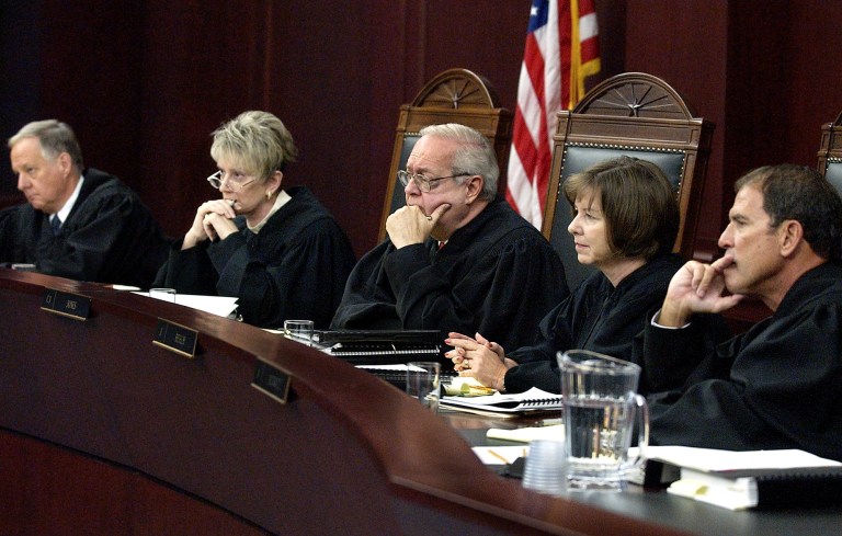 Members of the Arizona Supreme Court, from left, Justice Michael D. Ryan, Vice Chief Justice Ruth V. McGregor, Chief Justice Charles E. Jones, Justice Rebecca White Berch and Justice Andrew D. Hurwitz, hear arguments Tuesday, Sept. 9, 2003.