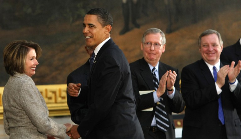 President Barack Obama holds the hand of House Speaker Nancy Pelosi of Calif. after speaking at a Congressional ceremony celebrating Abraham Lincoln's 200th birthday, Thursday, Feb. 12, 2009, in the Capitol Rotunda on Capitol Hill in Washington. From left are, Pelosi, the president, Senate Minority Leader Mitch McConnell of Ky., and Senate Majority Whip Richard Durbin of Ill.