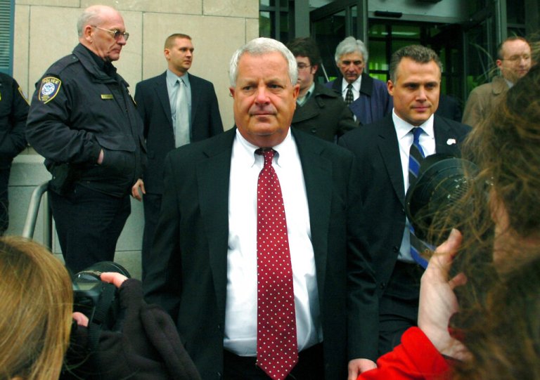 Michael Conahan, center, leaves the federal courthouse in Scranton, Pennsylvania.
