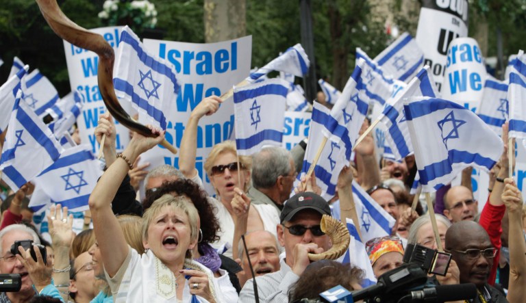 Cheryl Schechterly, left, of Bloomsberg, Penn., chants slogans during a demonstration near the United Nations headquarters, Wednesday, Sept. 21, 2011 in New York, against the Durban III racism conference scheduled for Thursday, Sept. 22 at the U.N. Ten years ago, the U.N.'s first conference on racism ended up in fierce acrimony, with accusations that it was hijacked to bash Israel, Zionism and Jews.