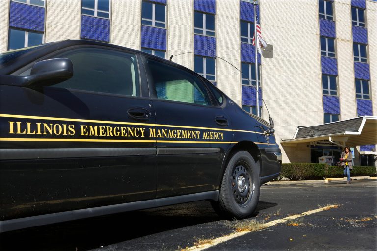 In this Friday, Oct. 14, 2016 photo, an Illinois Department of Emergency Management vehicle is parked at the entrance to their office in Springfield, Ill. (AP Photo/Seth Perlman)
