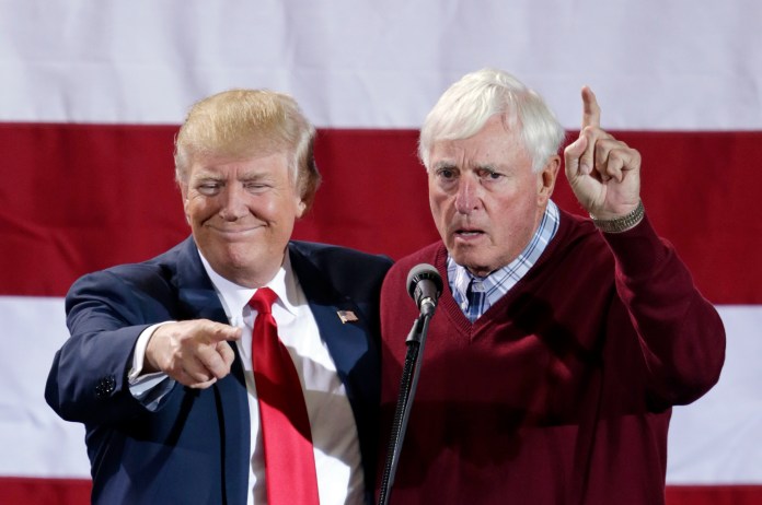 Former basketball coach Bob Knight, right, appears onstage with Republican presidential candidate Donald Trump during a campaign rally in Grand Rapids, Michigan, Oct. 31, 2016.