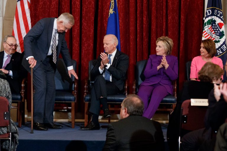 Former Senate Minority Leader Harry Reid, D-Nev., sits down after speaking during a ceremony to unveil his portrait, on Capitol Hill, Thursday, Dec. 8, 2016. From left are the Democratic's other party leaders, Sen. Chuck Schumer, D-N.Y., Reid, 2020 Democratic presidential candidate Joe Biden, former Secretary of State Hillary Clinton, and House Minority Leader Nancy Pelosi. The party's 2020 platform is critical of the advantages whites have.