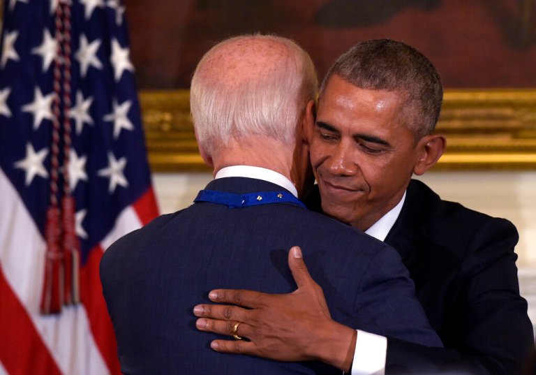 Vice President Joe Biden, left, hugs President Barack Obama, right, during a ceremony in the State Dining Room of the White House in Washington, Thursday, Jan. 12, 2017. (AP Photo/Susan Walsh)