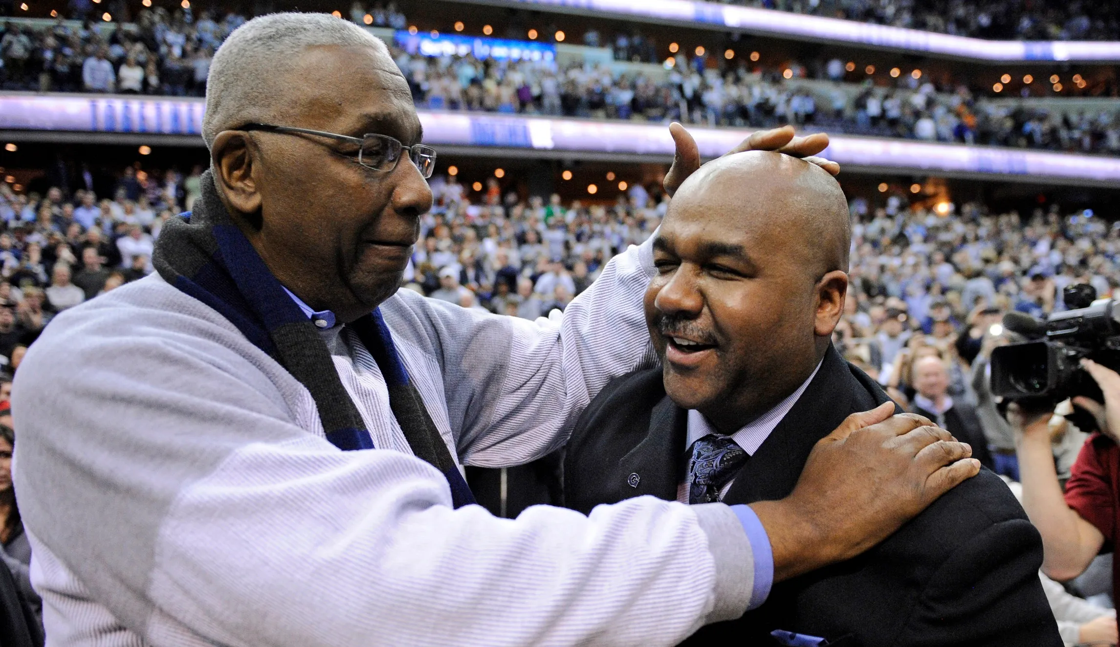 From students to our coach, one last huge hug for Big John Thompson
